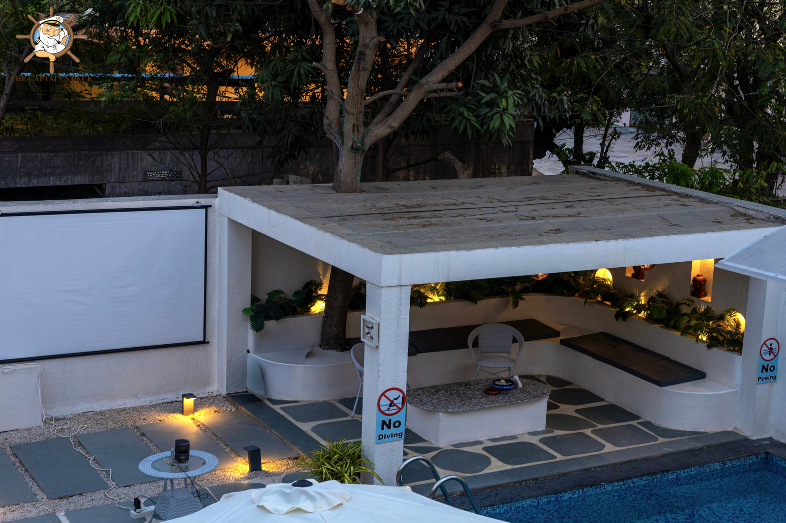 Nighttime shot of the villa's swimming pool with lights